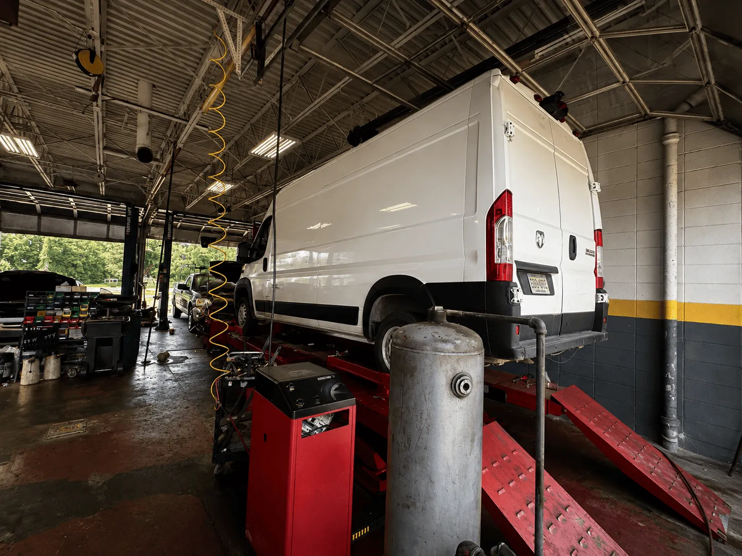 Work van in the service bay at Thomas Tire in Pearl, MS
