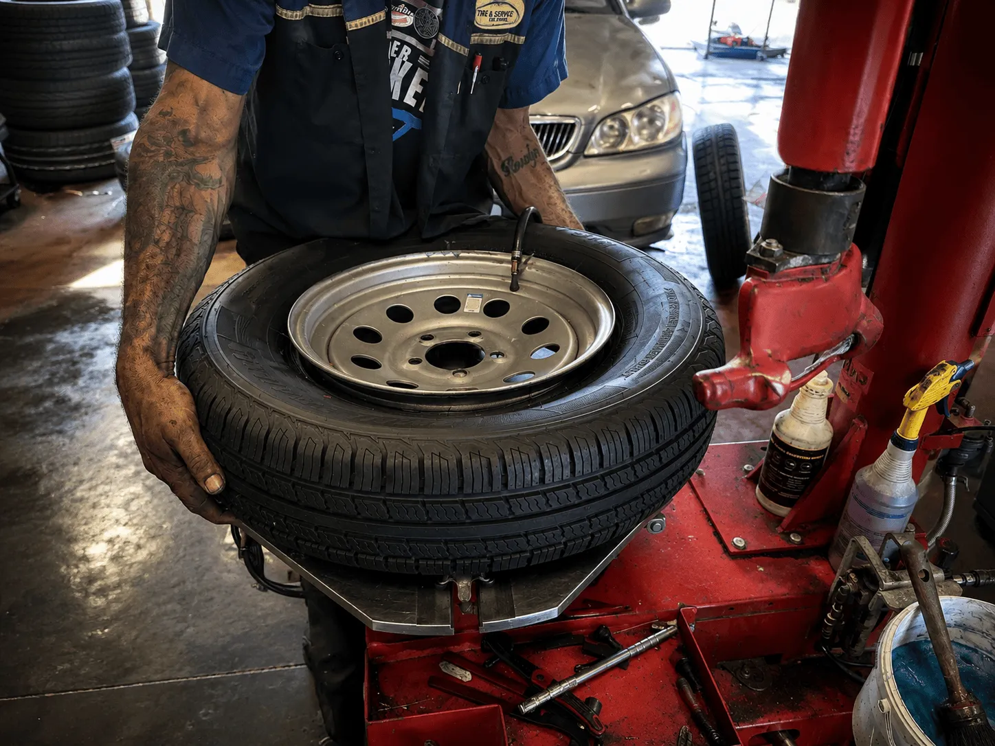 Technician mounting a tire for a Flowood, MS customer at Thomas Tire