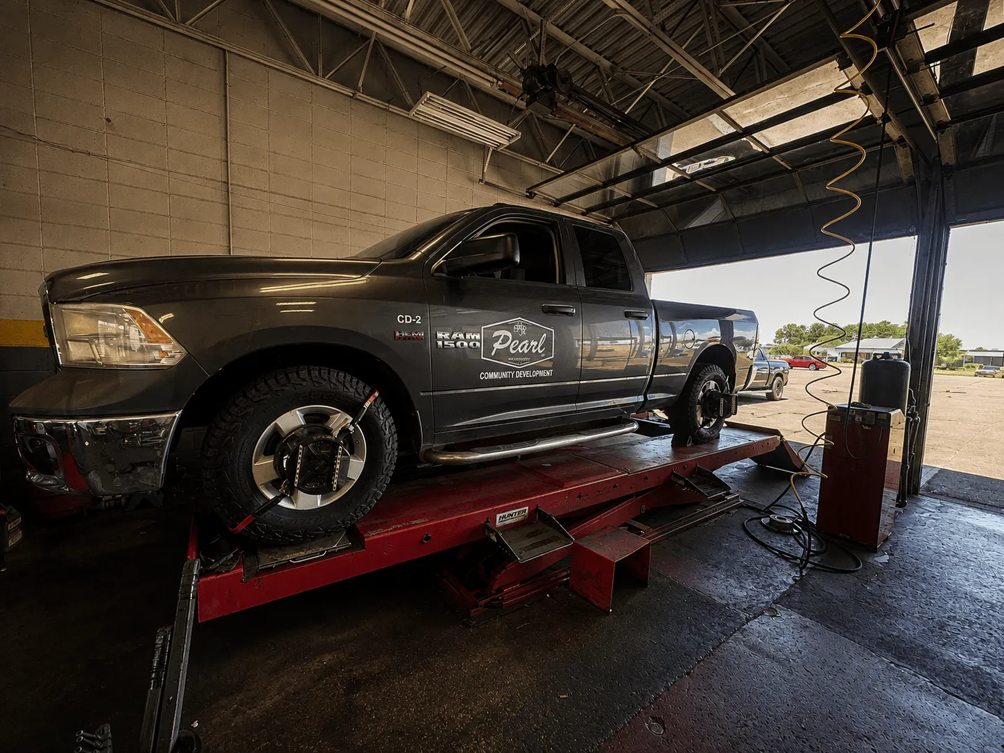 Truck on the alignment rack with sensors on the wheels at Thomas Tire in Pearl, MS
